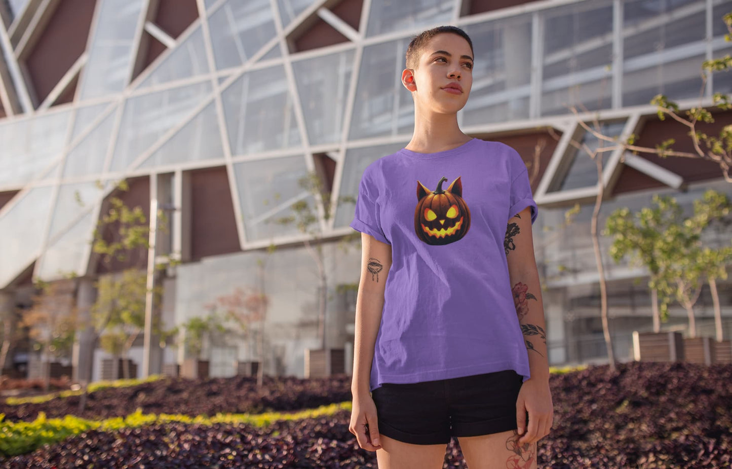 Model wearing unisex premium Cat-O’-Lantern Tomcat t-shirt with spooky and playful Halloween pumpkin cat design