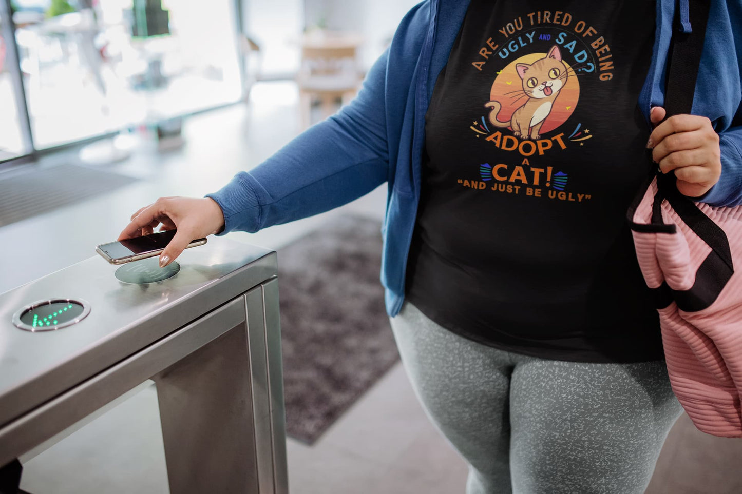 Model wearing Funny Sarcastic Cat vintage graphic tee with humorous slogan Adopt a Cat and Just Be Ugly