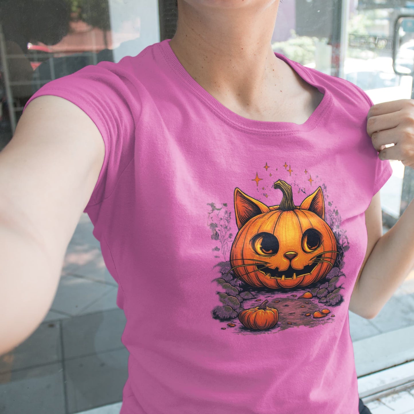 Model wearing classic women’s Cat-O’-Lantern Kittycat t-shirt with playful and artistic Halloween pumpkin cat design