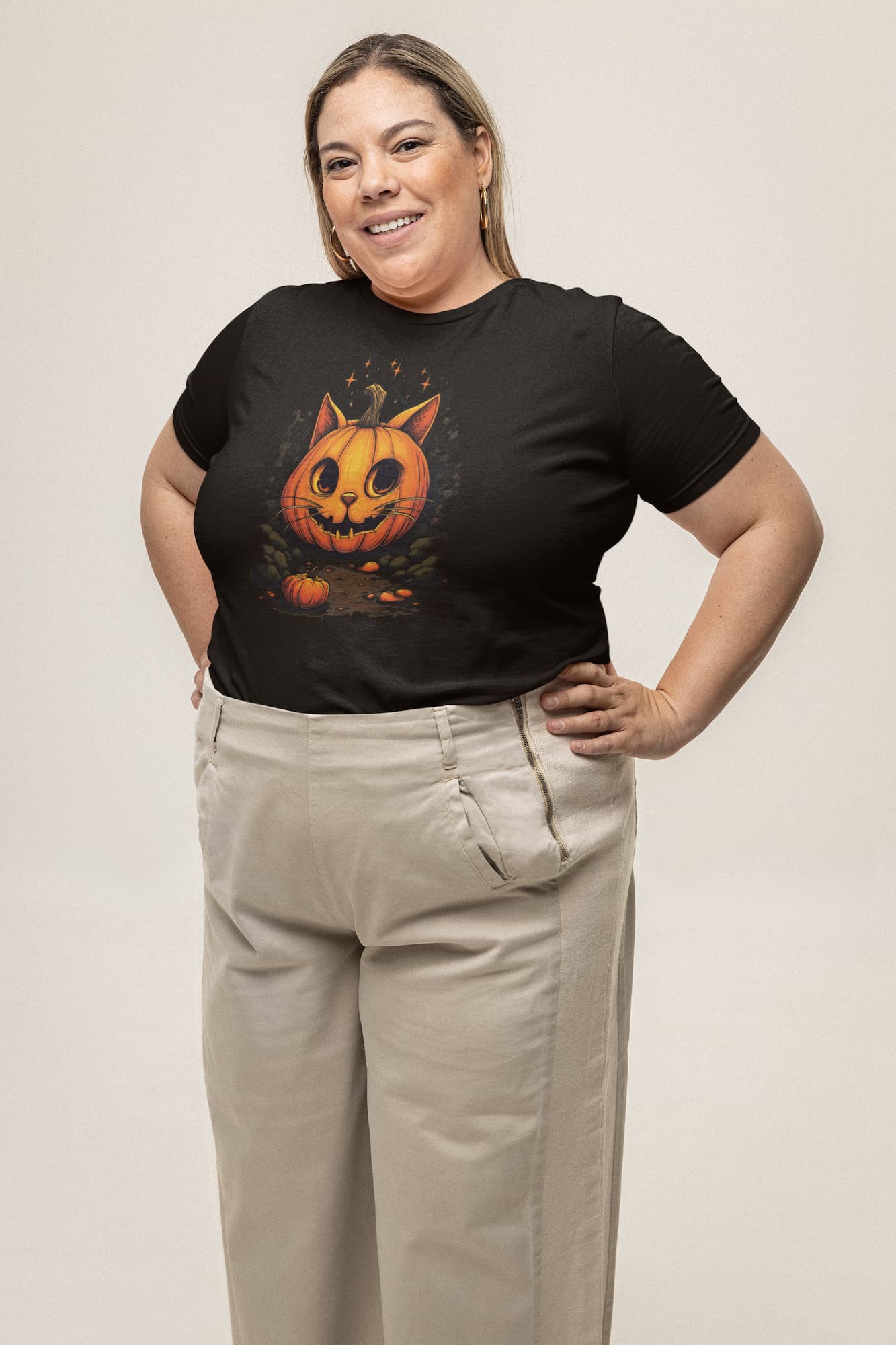 Model wearing classic women’s Cat-O’-Lantern Kittycat t-shirt with playful and artistic Halloween pumpkin cat designa