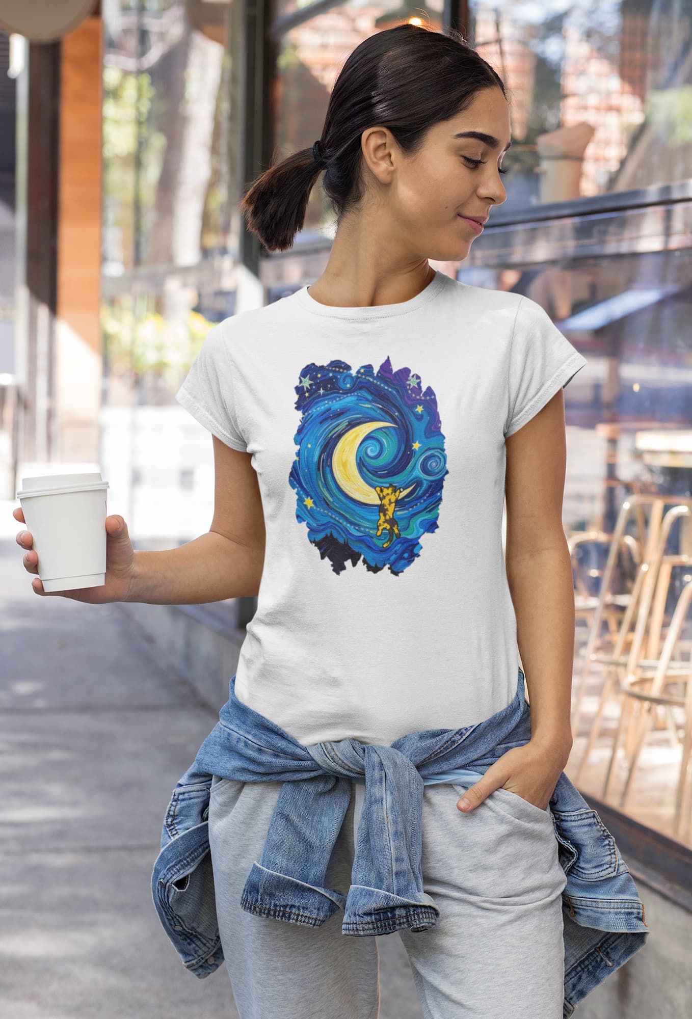 Model wearing The Starry Meownight Van Gogh inspired cat t-shirt, unisex premium graphic tee with swirling starry sky design