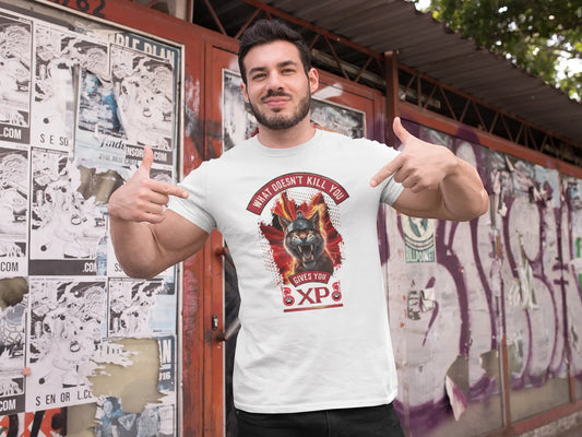 Digital mockup of a black t-shirt featuring a centered print of a furious Spartan cat with a helmet, surrounded by flames, and the text "What Doesn't Kill You Gives You XP".