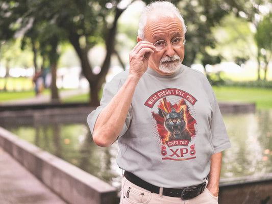 Digital mockup of a black t-shirt featuring a centered print of a furious Spartan cat with a helmet, surrounded by flames, and the text "What Doesn't Kill You Gives You XP".