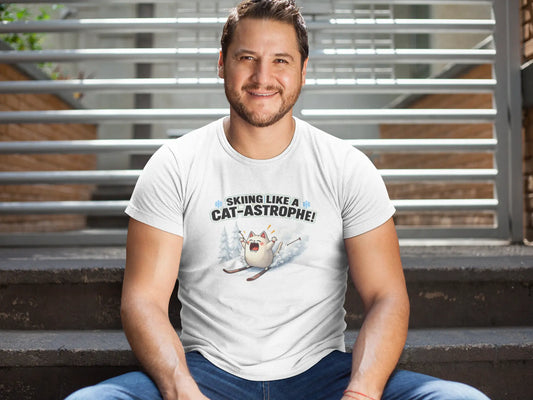 Model wearing Cat-Astrophe Winter Cat T-Shirt – unisex premium tee featuring a funny cat tumbling down a snowy mountain with ski poles flying.