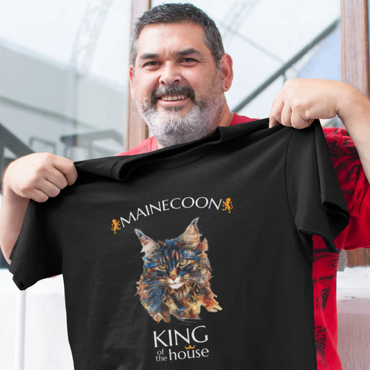 Mockup of the 'King of the House – The Maine Coon Edition' T-shirt featuring a majestic Maine Coon cat illustrated in fragmented abstract style, symbolizing feline royalty.