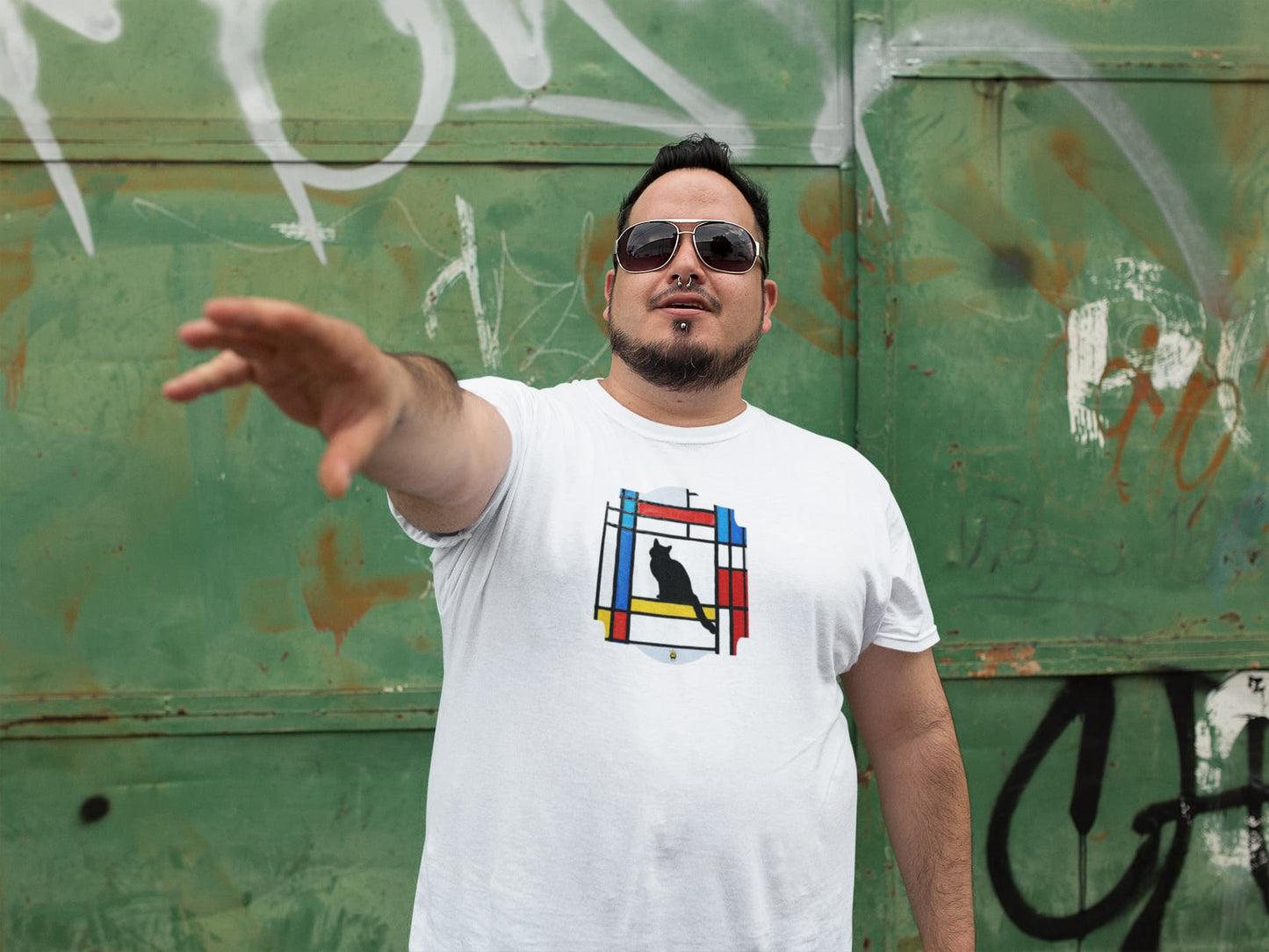 Model wearing Meowdrian Mondrian inspired cat t-shirt, abstract art unisex premium graphic tee with colorful feline design