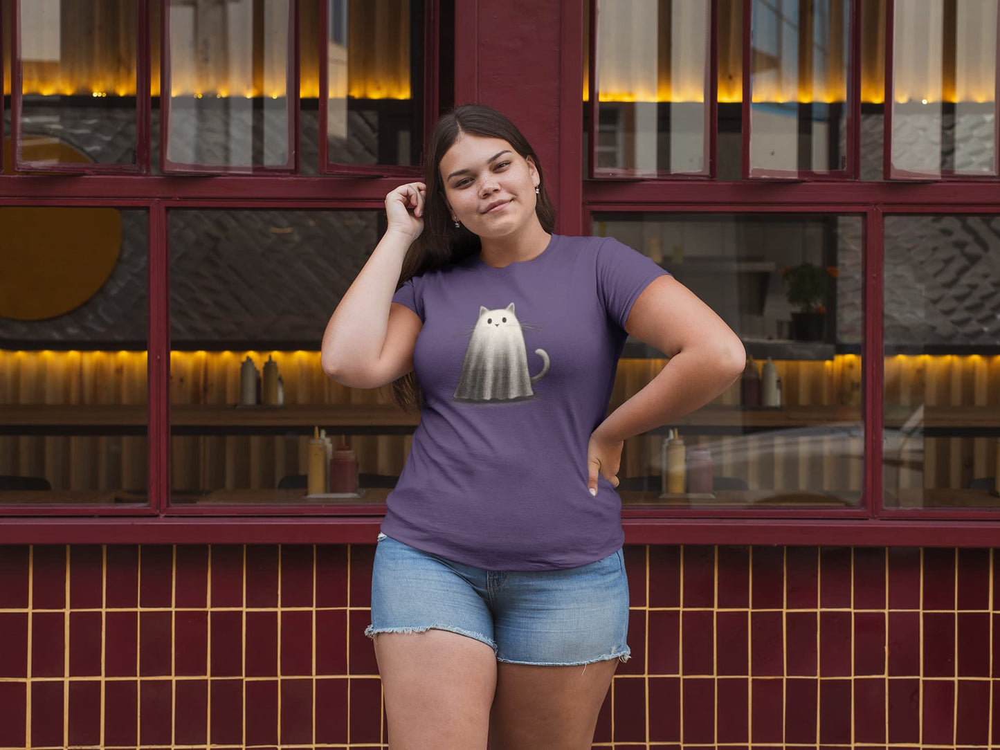 Model wearing classic women’s Whiskered Phantom Halloween t-shirt with subtle and artistic ghost cat design