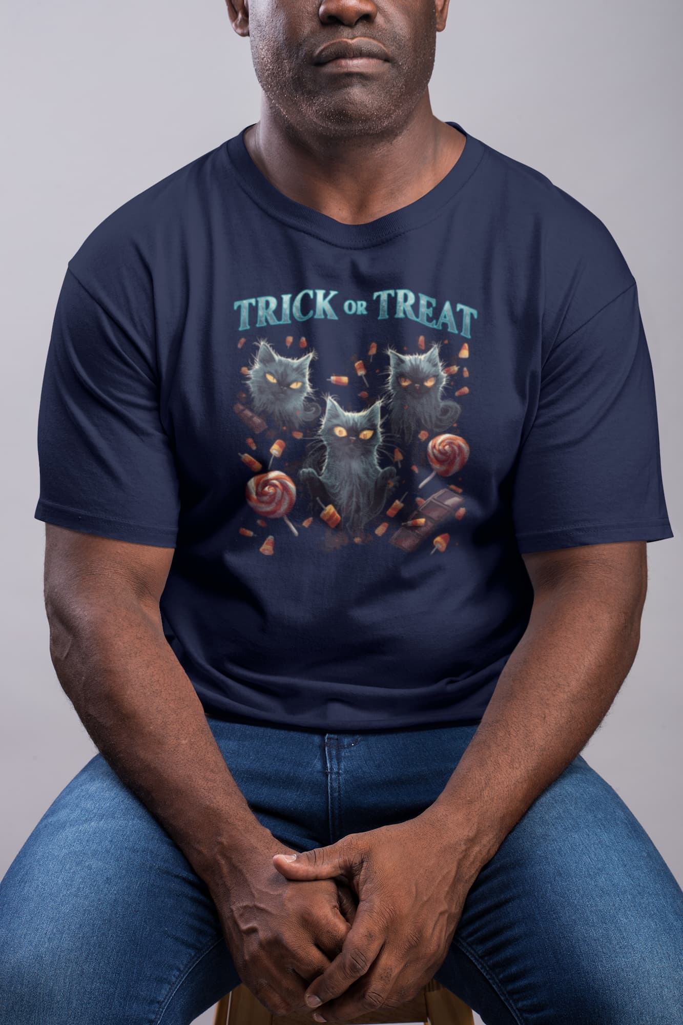 Model wearing unisex premium Sweet But Spooky Halloween t-shirt with ghost cat and candy poster-art design