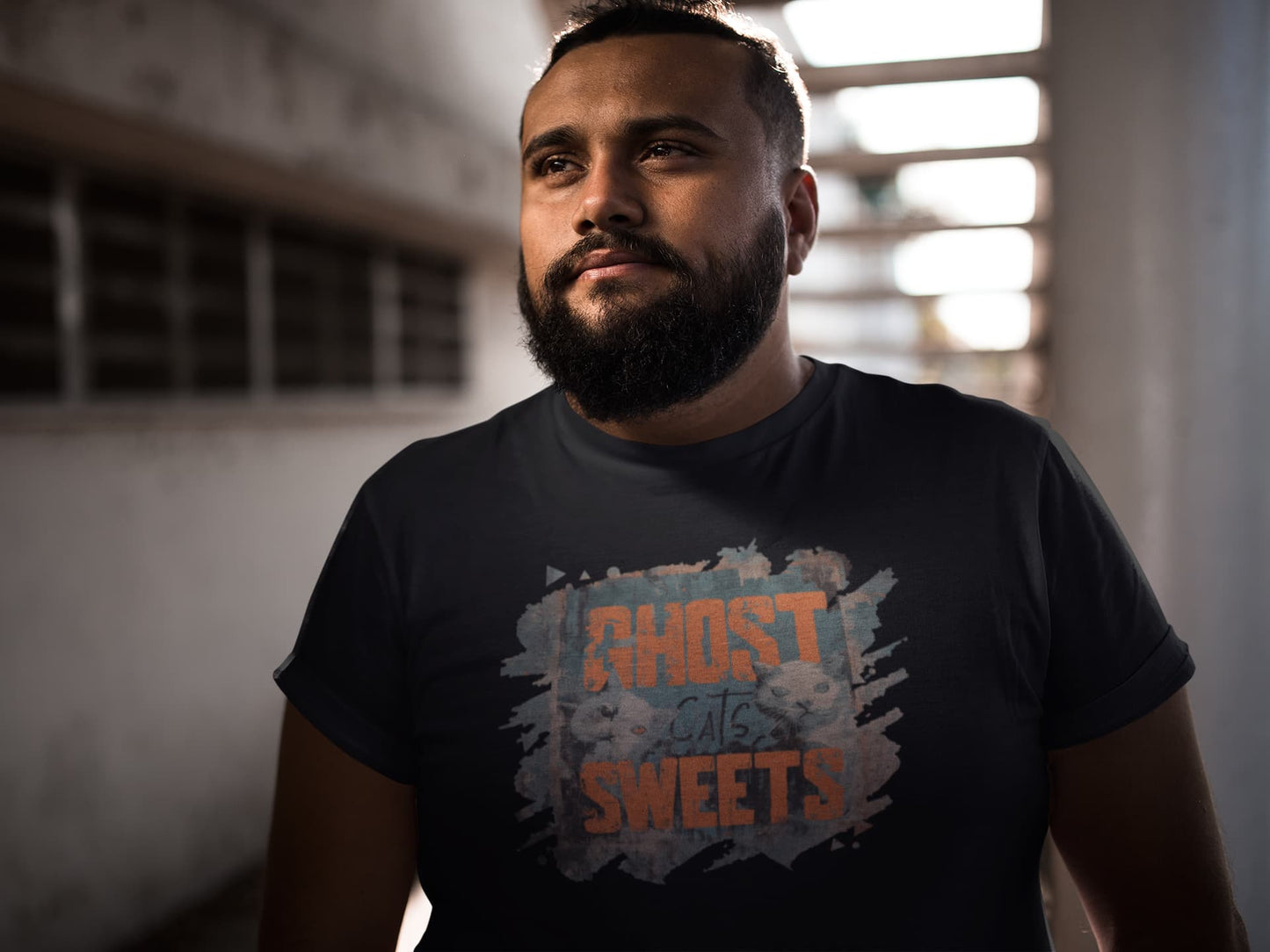 Model wearing unisex premium Ghost Sweets Halloween t-shirt with retro ghost cat and distressed poster-art design