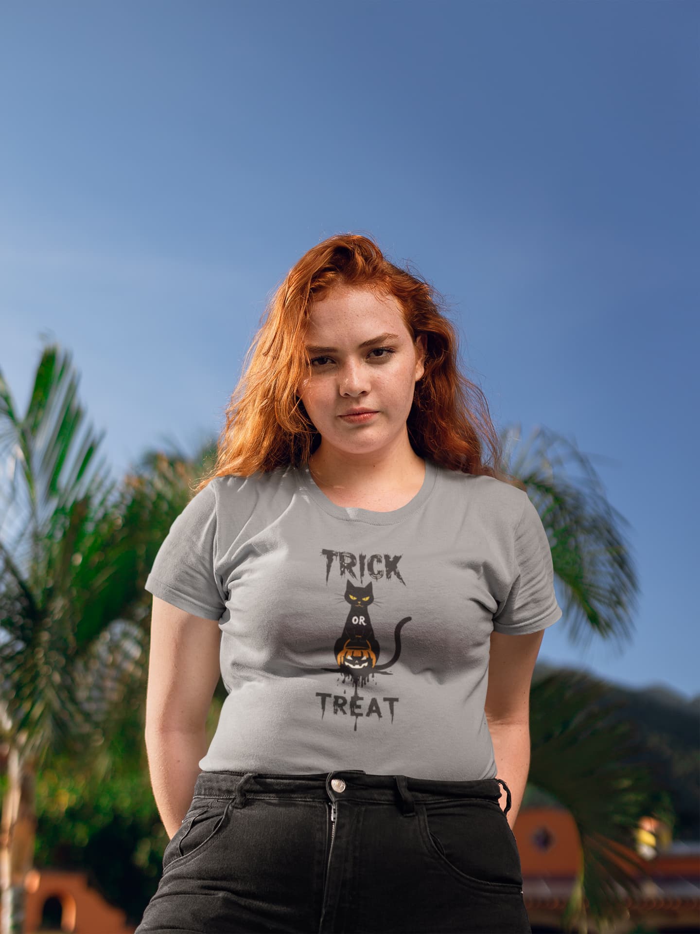 Model wearing No Candy No Mercy Classic Women’s Halloween t-shirt with sleek black and orange minimalist cat design