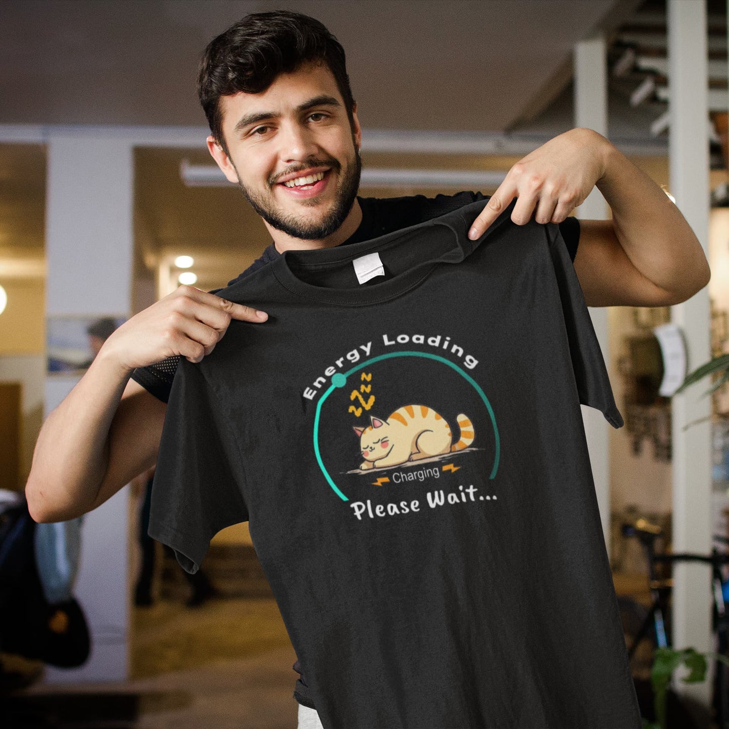 Model wearing Charger Cat Funny Sleeping Cat T-Shirt – unisex premium tee with napping kitty and energy loading graphic.