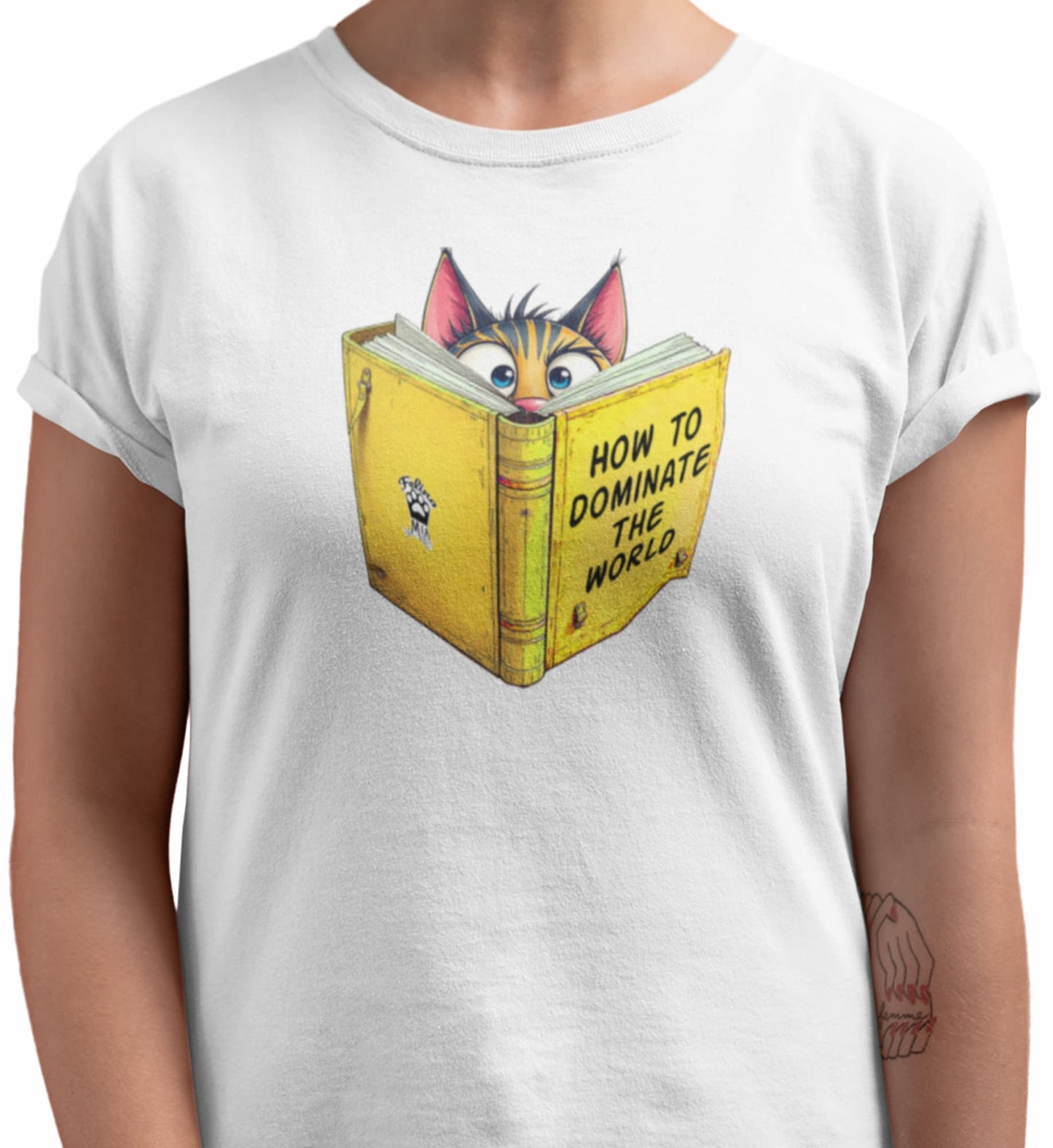 Close-up of How to Dominate the World Funny Conspirator Cat T-Shirt – graphic of focused cat reading book titled How to Dominate the World.