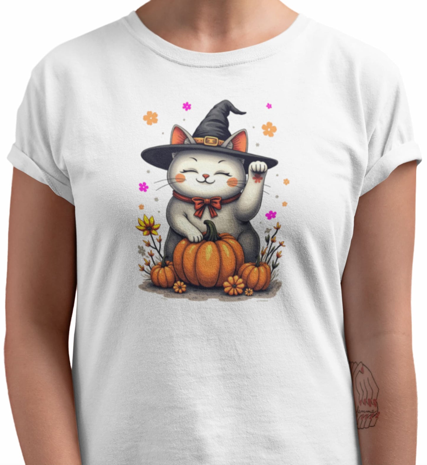 Close-up of Witch Luck cat t-shirt artwork showing witch hat Maneki-neko with raised paw, floral gradients, and playful magical details