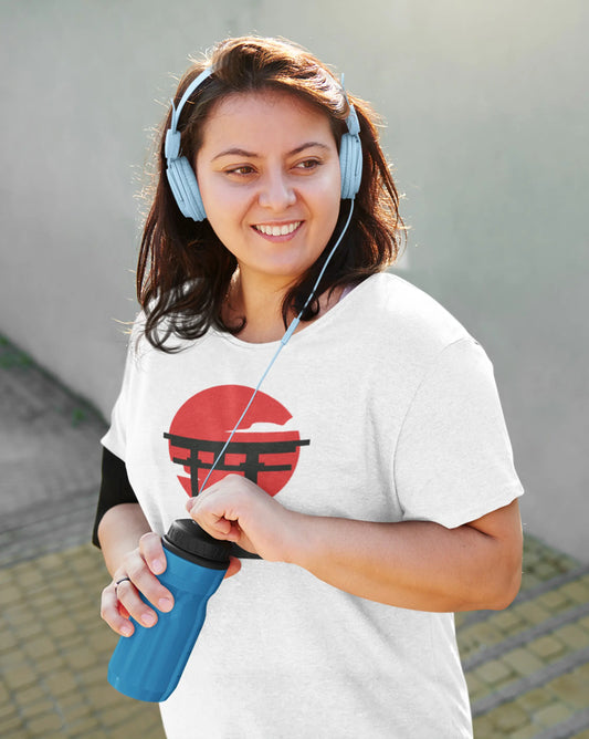 Model wearing Manekineko Tori T-Shirt – premium unisex tee with silhouetted lucky cat framed by tori gate and rising sun design.