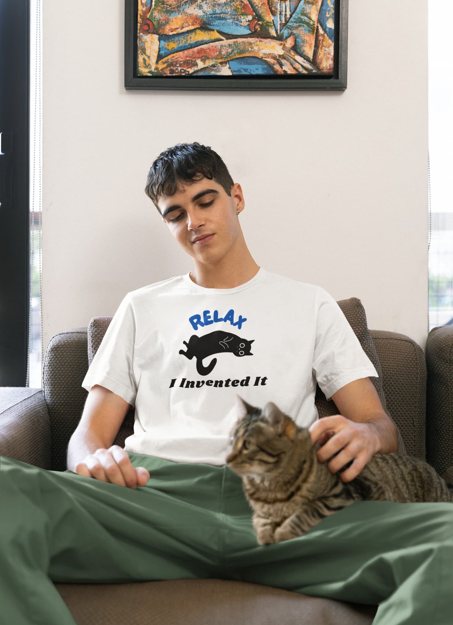 Model wearing Relax Funny Zen Cat T-Shirt ā unisex premium tee with minimalist lounging cat design.