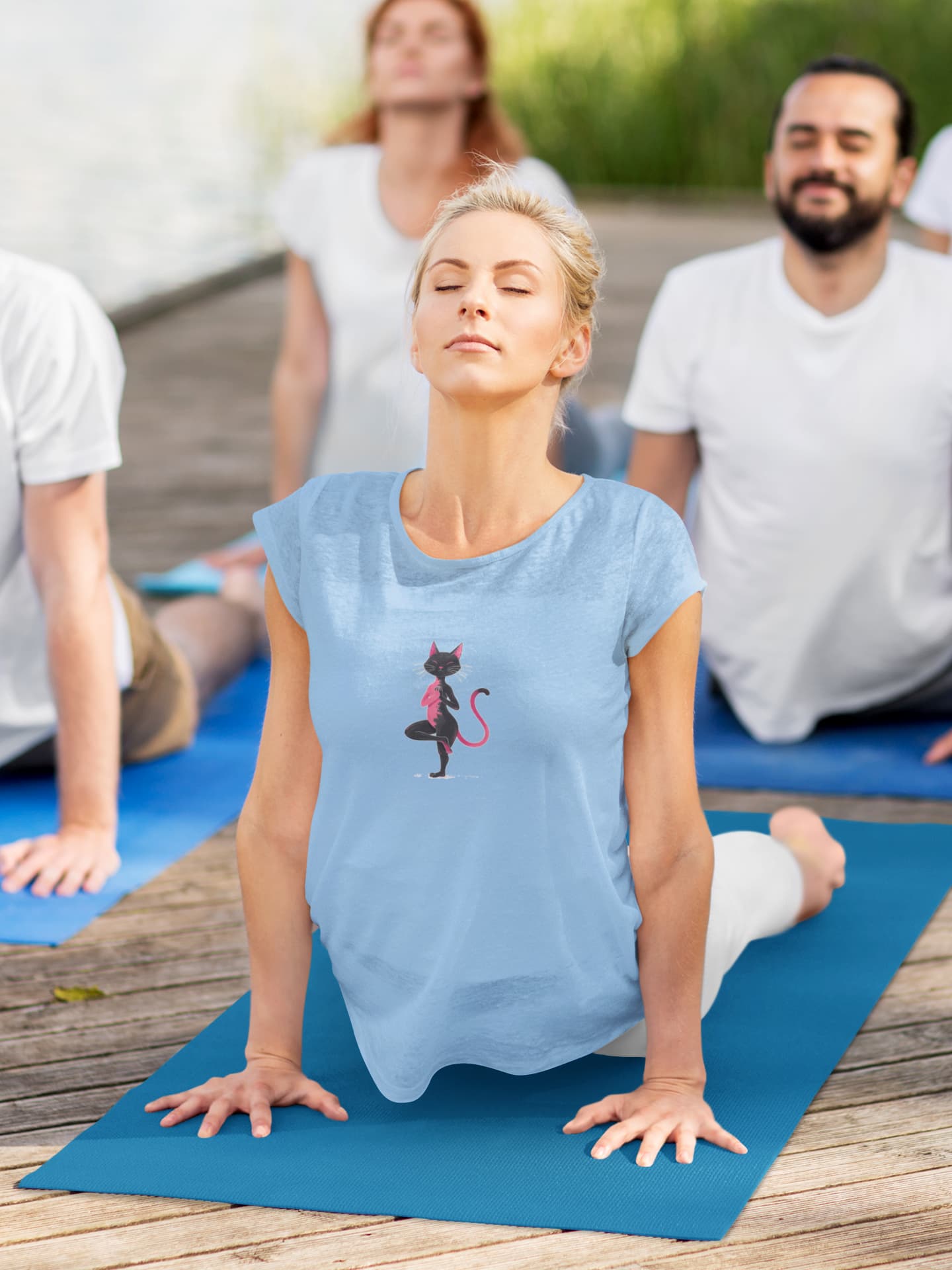 Model wearing Vrkasana Yoga Cat t-shirt showcasing graceful cat holding yoga tree pose design
