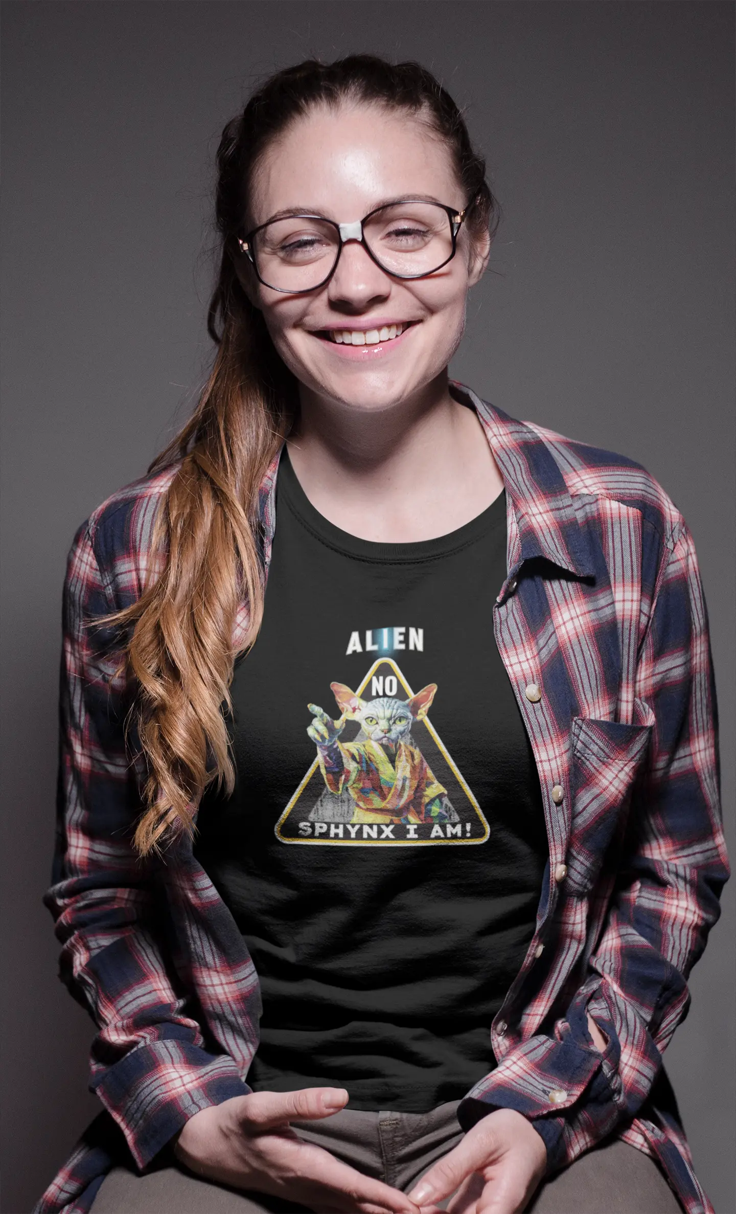 Mockup of the 'I Am Sphynx, Not Alien - The Galactic Hairless’ T-shirt featuring a Sphynx cat styled as a wise galactic master, blending feline charm with sci-fi humor.