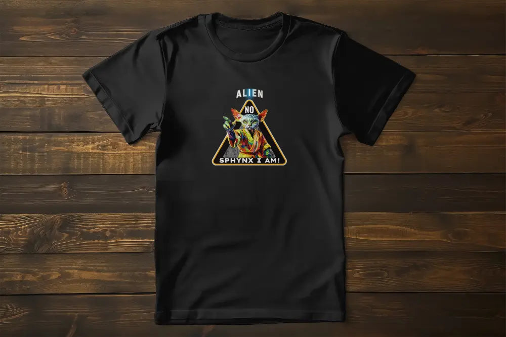 Flat lay of the 'I Am Sphynx, Not Alien - The Galactic Hairless’ T-shirt showing the detailed artwork of a Sphynx cat inspired by galactic themes and pop culture aesthetics.