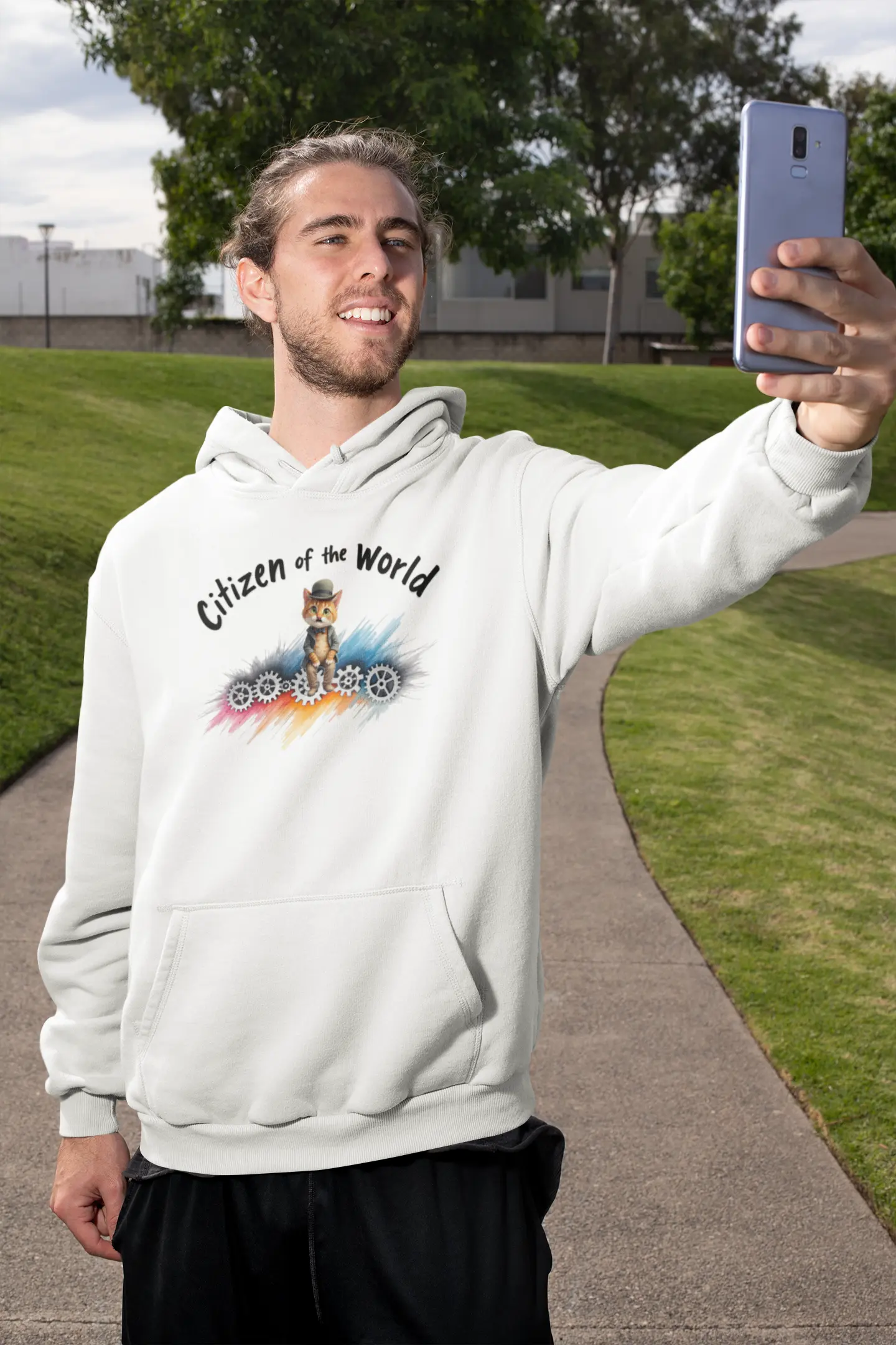 Model wearing Citizen of the World Hoodie – unisex premium tee featuring a cat in a bowler hat and tie, inspired by Chaplin’s Modern Times with a feline twist.