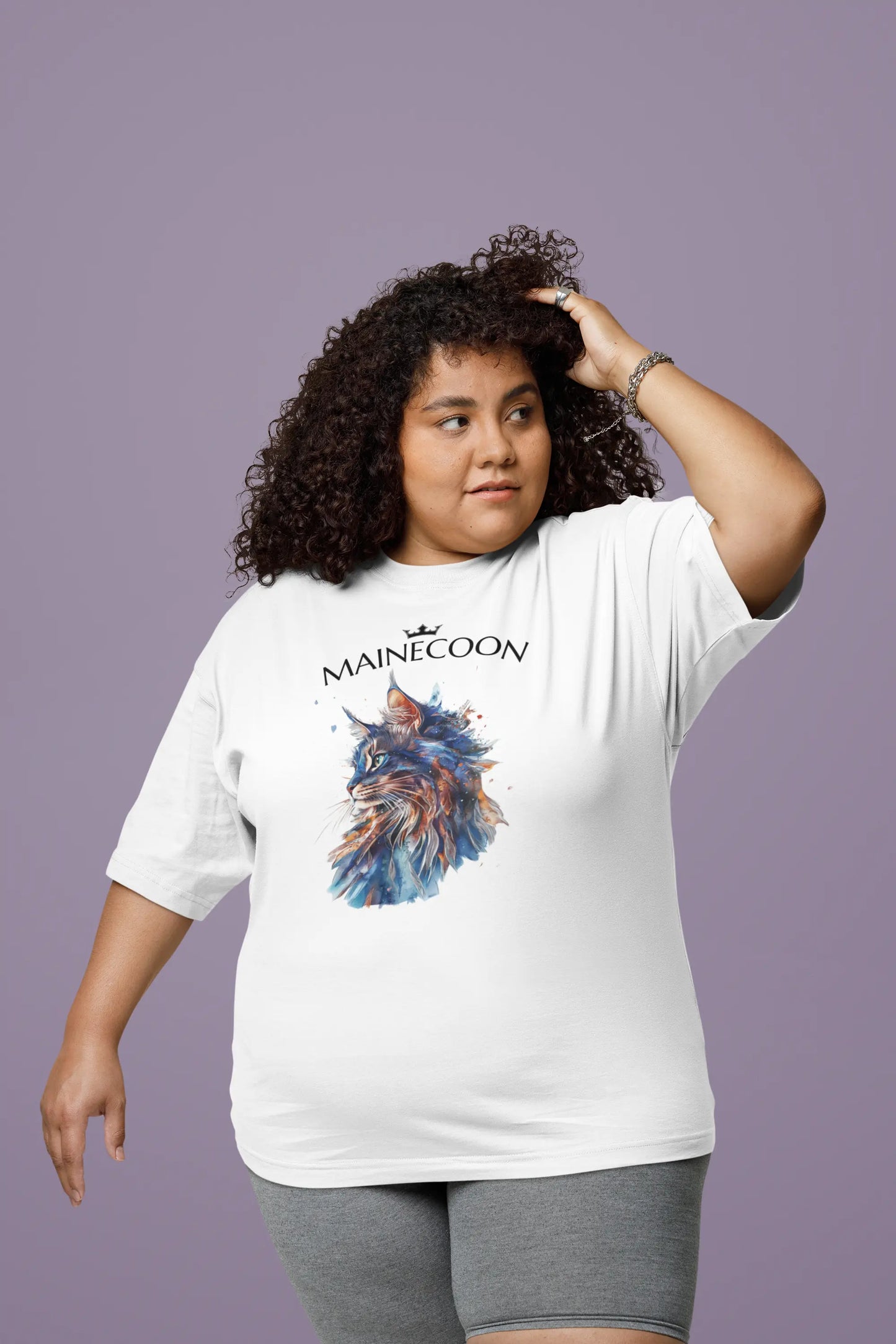 Model wearing the 'Majestic Mane – The Maine Coon Edition' T-shirt with a graceful, artistic cat portrait that celebrates the noble presence of the Maine Coon.