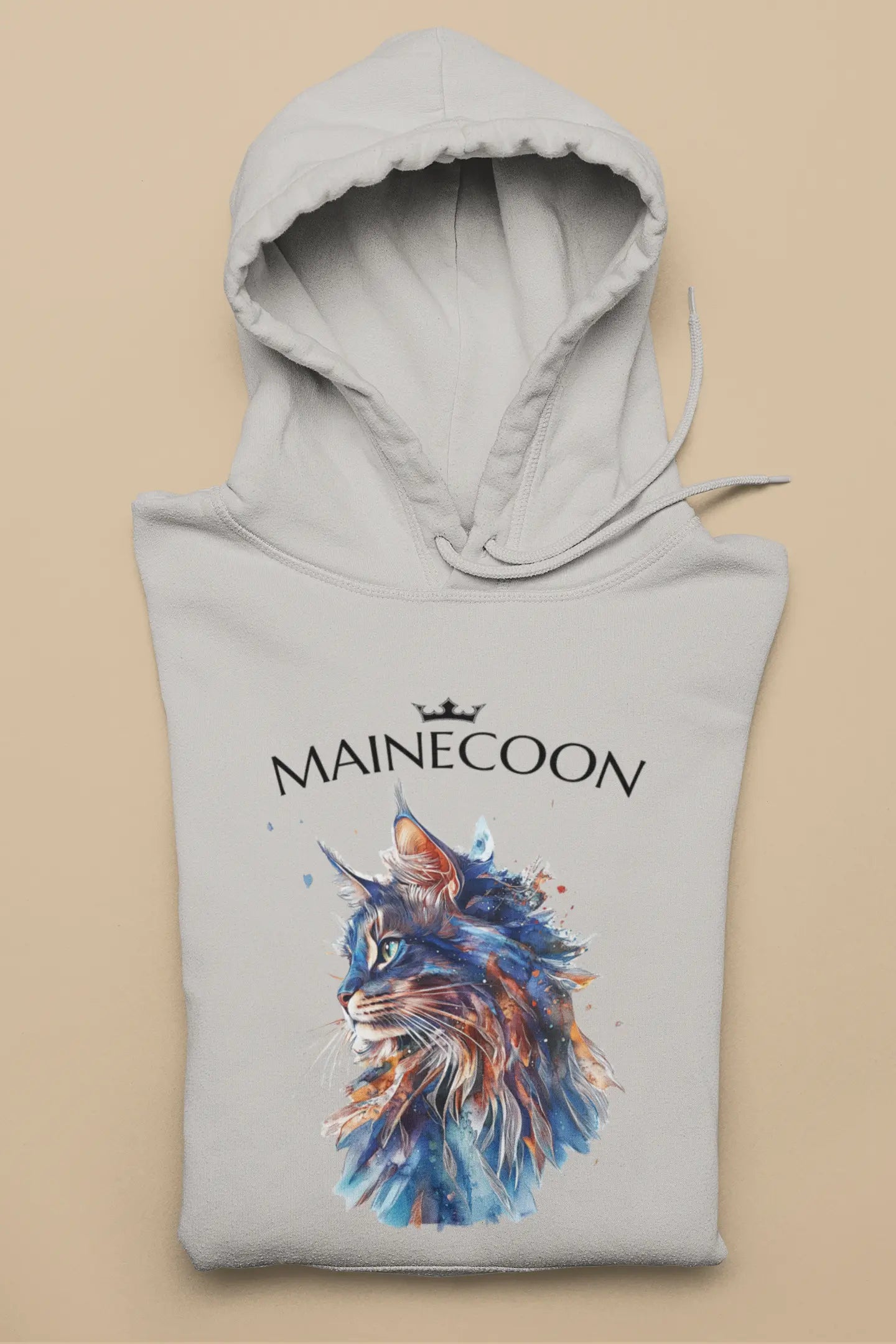 Flat lay of the 'Majestic Mane – The Maine Coon Edition' Hoodie showing a minimalist, elegant Maine Coon design with fluid blue and brown brushwork.