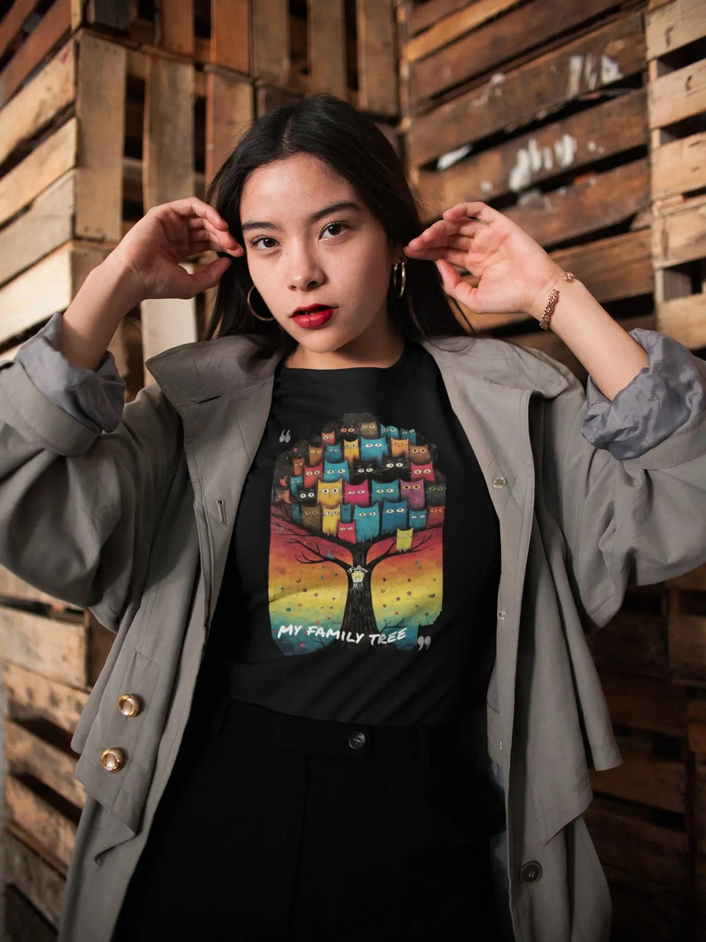 Model wearing My Family Tree cat graphic tee with colorful feline family tree artwork, casual unisex premium t-shirt