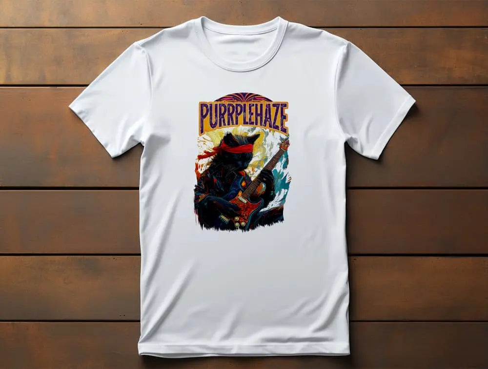 The “PURRPLE HAZE – Psychedelic Guitar” t-shirt displayed on a neutral background, showcasing artwork of a black cat with a red headband playing guitar in colorful abstract painting style.