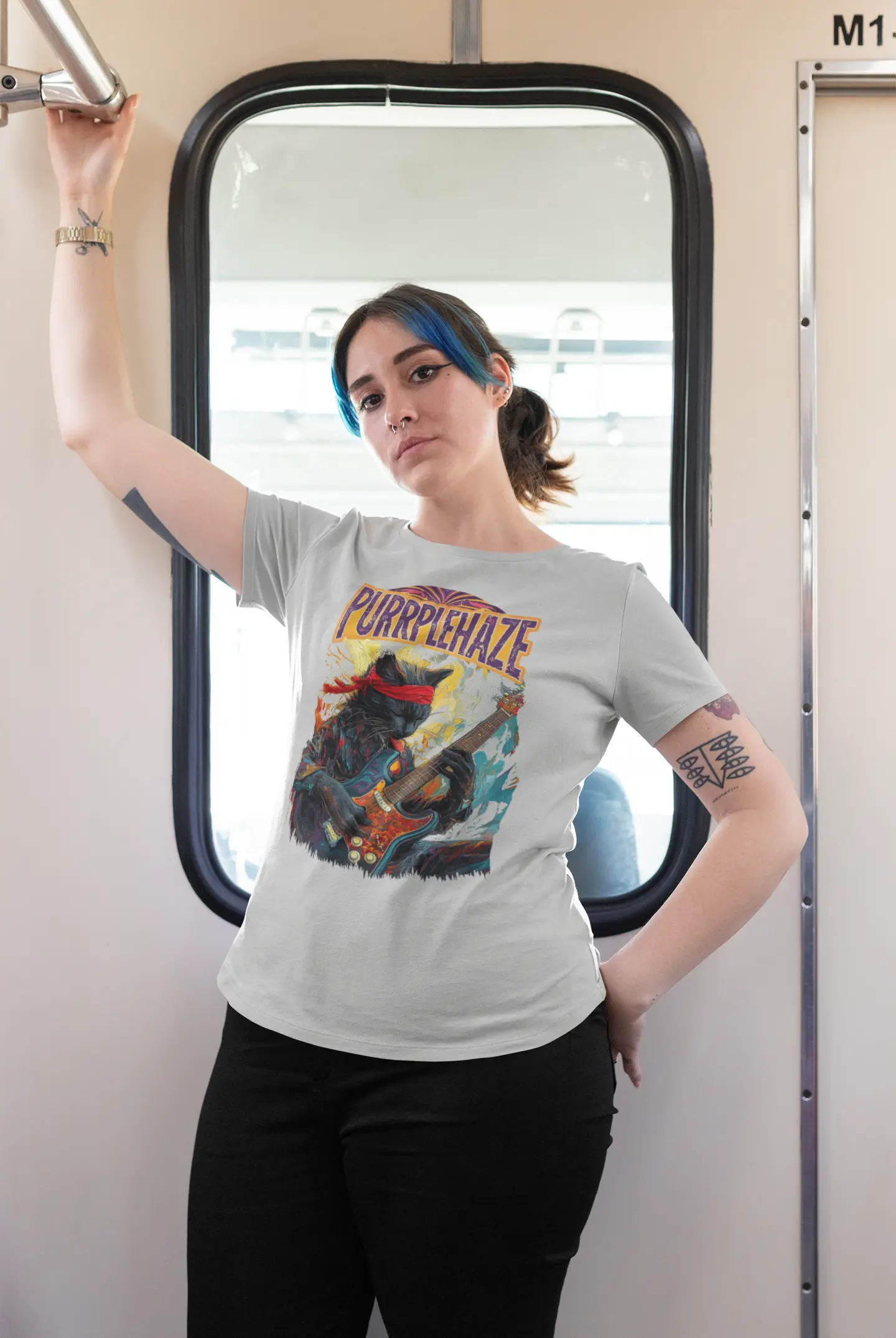 Mockup of the black t-shirt “PURRPLE HAZE – Psychedelic Guitar” featuring a black cat with a red headband playing guitar in a psychedelic style inspired by Jimi Hendrix.