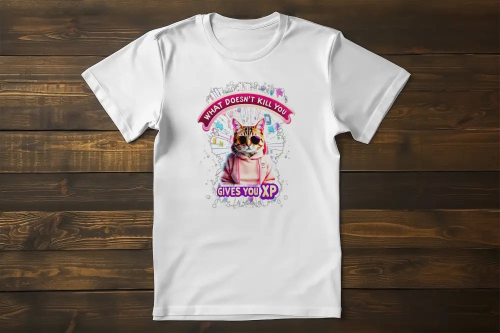 Flat lay of the 'Gamer Cat: What Doesn’t Kill You Gives You XP!' T-shirt displaying the illustrated gamer cat and XP-inspired typography.