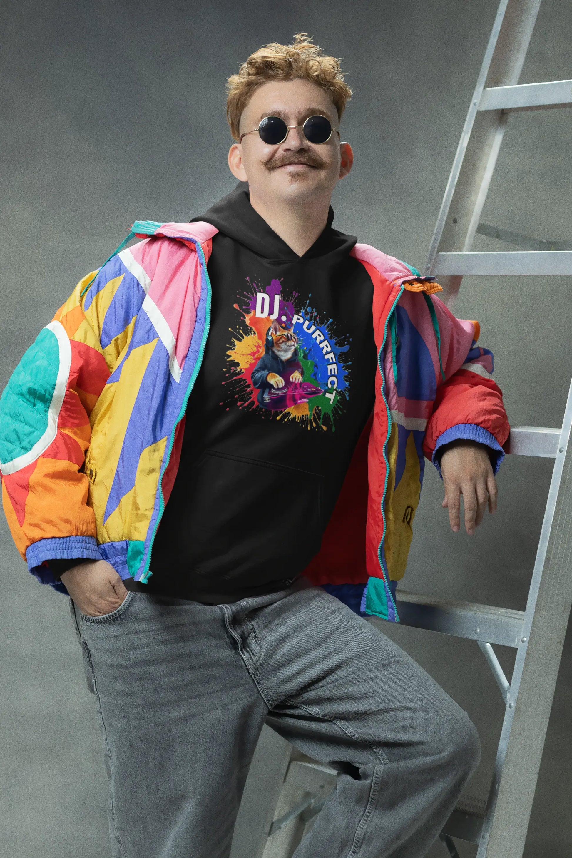 Person wearing Beat Maker Cat unisex Hoodie at music event – stylish cat lover tee with colorful DJ design and pride-inspired vibes.