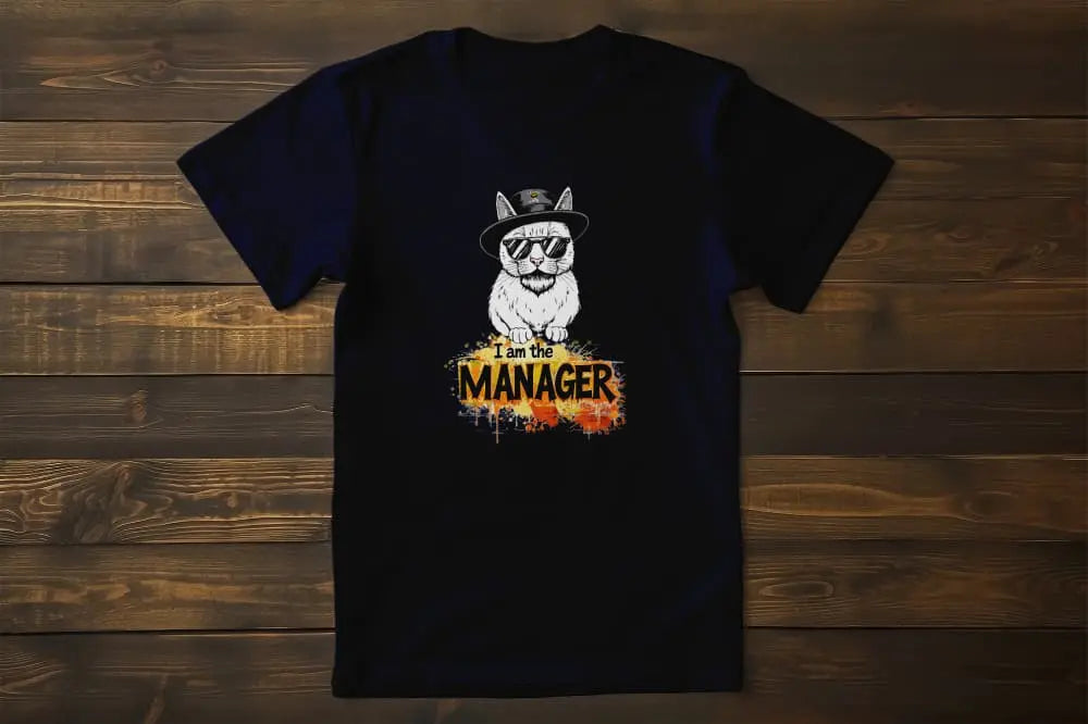 Flat → I Am the Maneger T-Shirt – unisex premium cat shirt with minimalist design of a stylish feline in sunglasses and hat, blending humor and attitude.