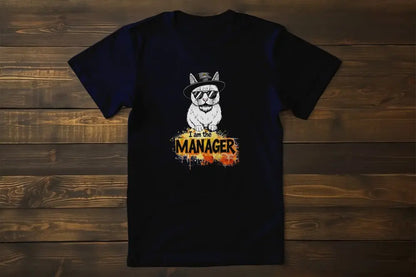 Flat → I Am the Maneger T-Shirt – unisex premium cat shirt with minimalist design of a stylish feline in sunglasses and hat, blending humor and attitude.