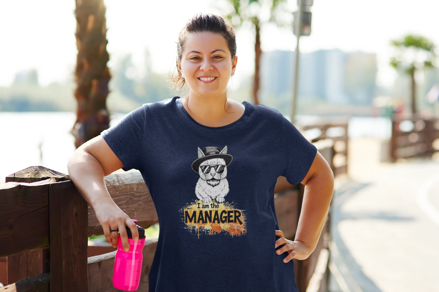 Person wearing I Am the Maneger T-Shirt – cool minimalist cat design with pop culture references and confident feline vibes.