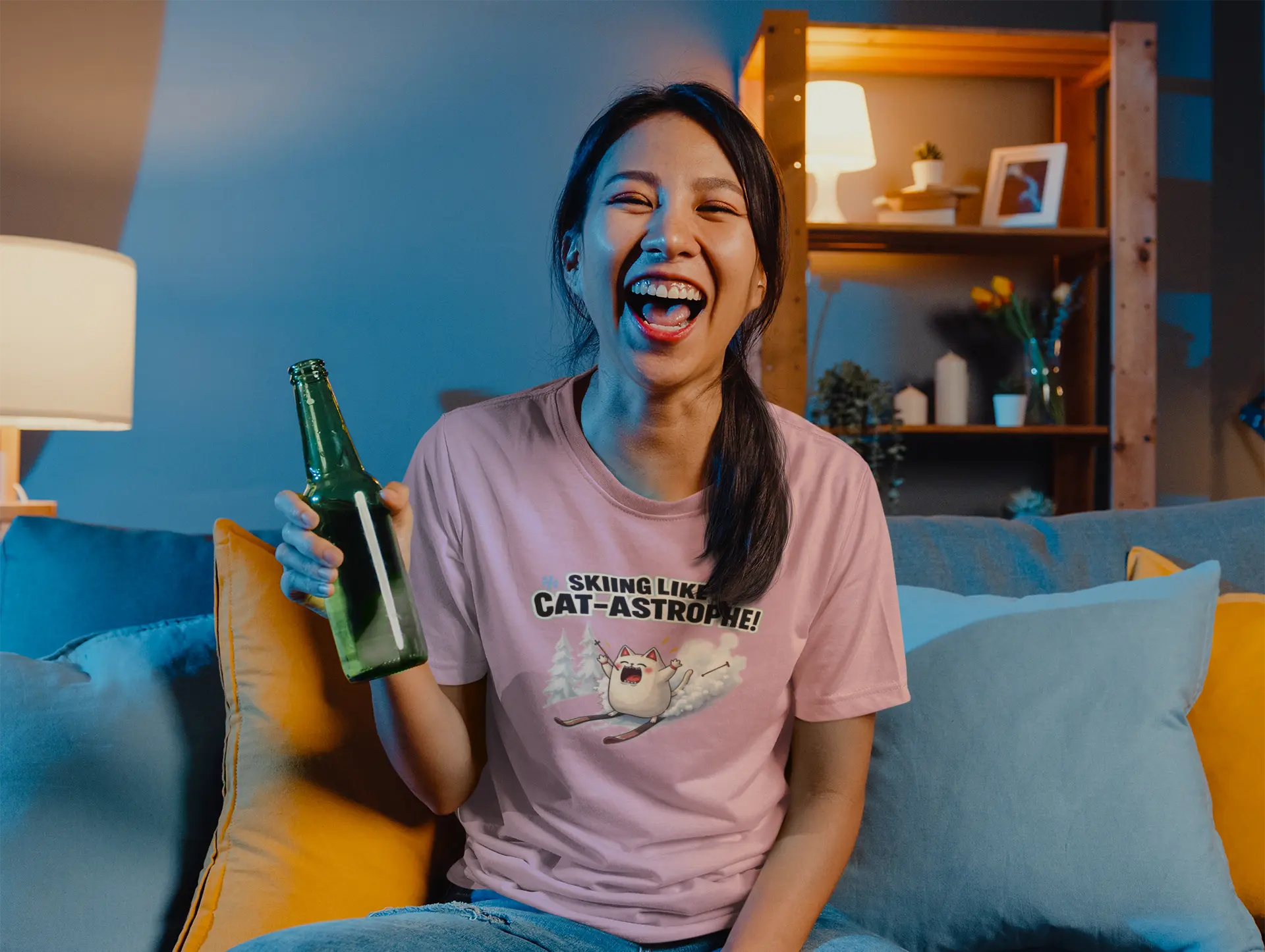 Person wearing Cat-Astrophe Winter Cat T-Shirt in snowy mountain setting – fun unisex tee for cat lovers who enjoy ski humor and playful winter vibes.