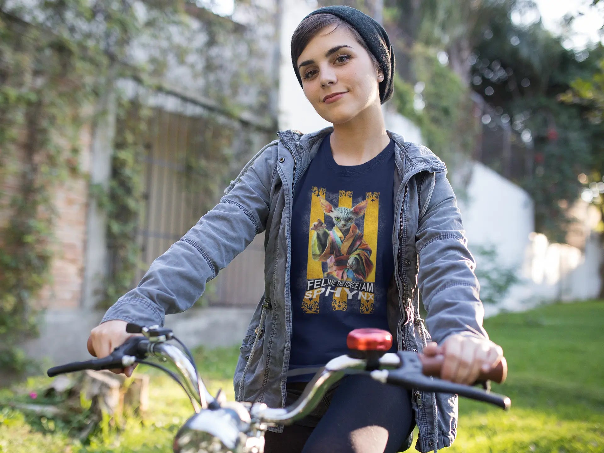 Model wearing the 'Feline Power – Sphynx Unleased' T-shirt with a bold and humorous sci-fi cat design, perfect for fans of parody and pop culture.