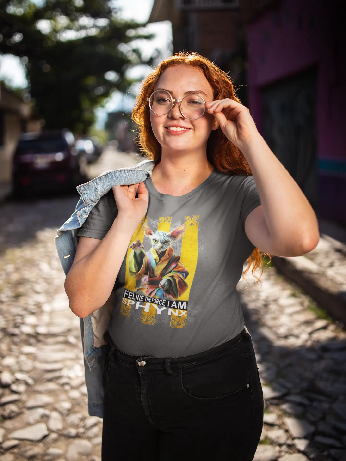 Model wearing the 'Feline Power – Sphynx Unleased' T-shirt with a bold and humorous sci-fi cat design, perfect for fans of parody and pop culture.