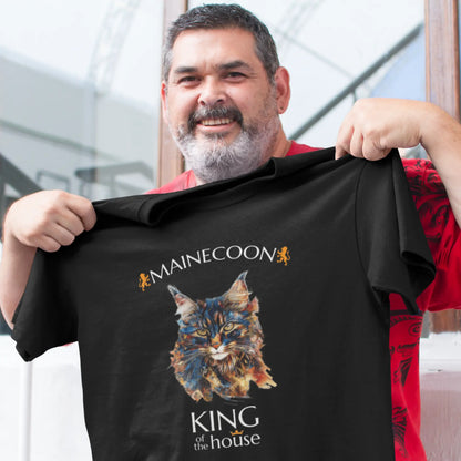 Mockup of the 'King of the House – The Maine Coon Edition' T-shirt featuring a majestic Maine Coon cat illustrated in fragmented abstract style, symbolizing feline royalty.