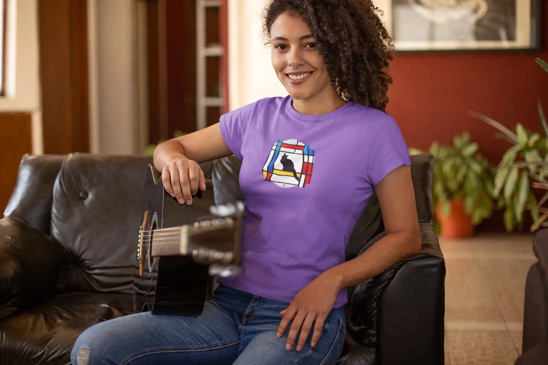 Model wearing Meowdrian Mondrian inspired cat t-shirt, abstract art unisex premium graphic tee with colorful feline design