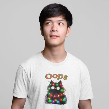 Model wearing Santa Claws Oops Funny Christmas Cat T-Shirt – unisex premium tee featuring black cat tangled in Christmas lights.