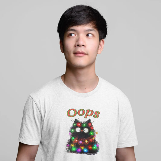 Model wearing Santa Claws Oops Funny Christmas Cat T-Shirt – unisex premium tee featuring black cat tangled in Christmas lights.