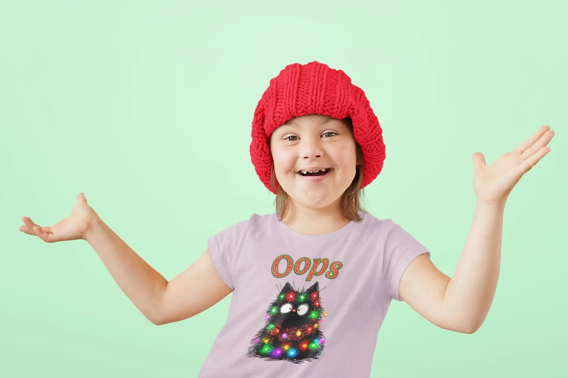 Person wearing Santa Claws Oops Cat T-Shirt while decorating Christmas tree – funny festive shirt for cat owners and holiday lovers.