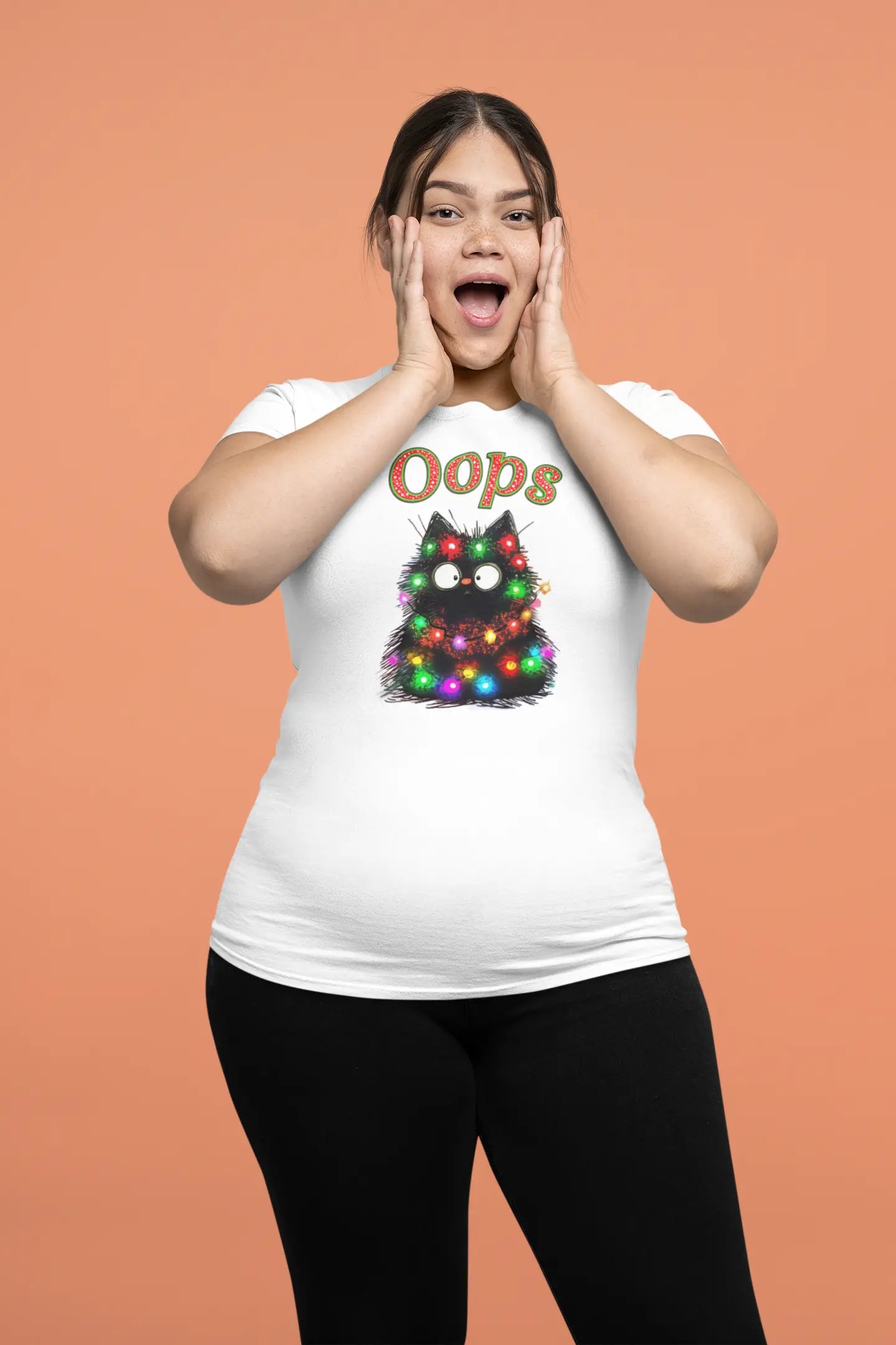 Model wearing Santa Claws Oops Funny Christmas Cat T-Shirt – unisex premium tee featuring black cat tangled in Christmas lights.