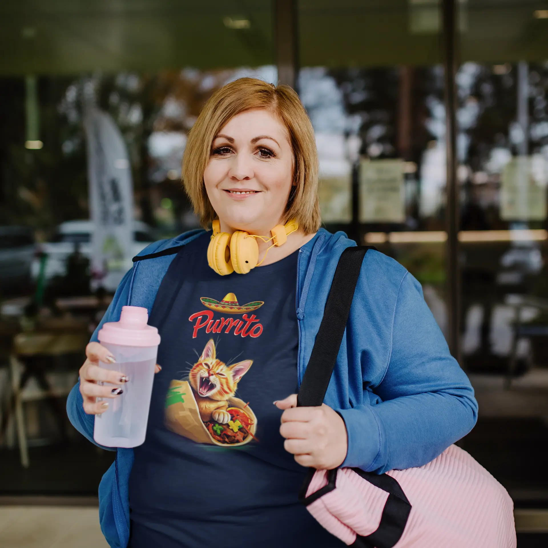 Model wearing Purrito Cat T-Shirt – funny burrito cat design with sombrero, unisex premium tee.