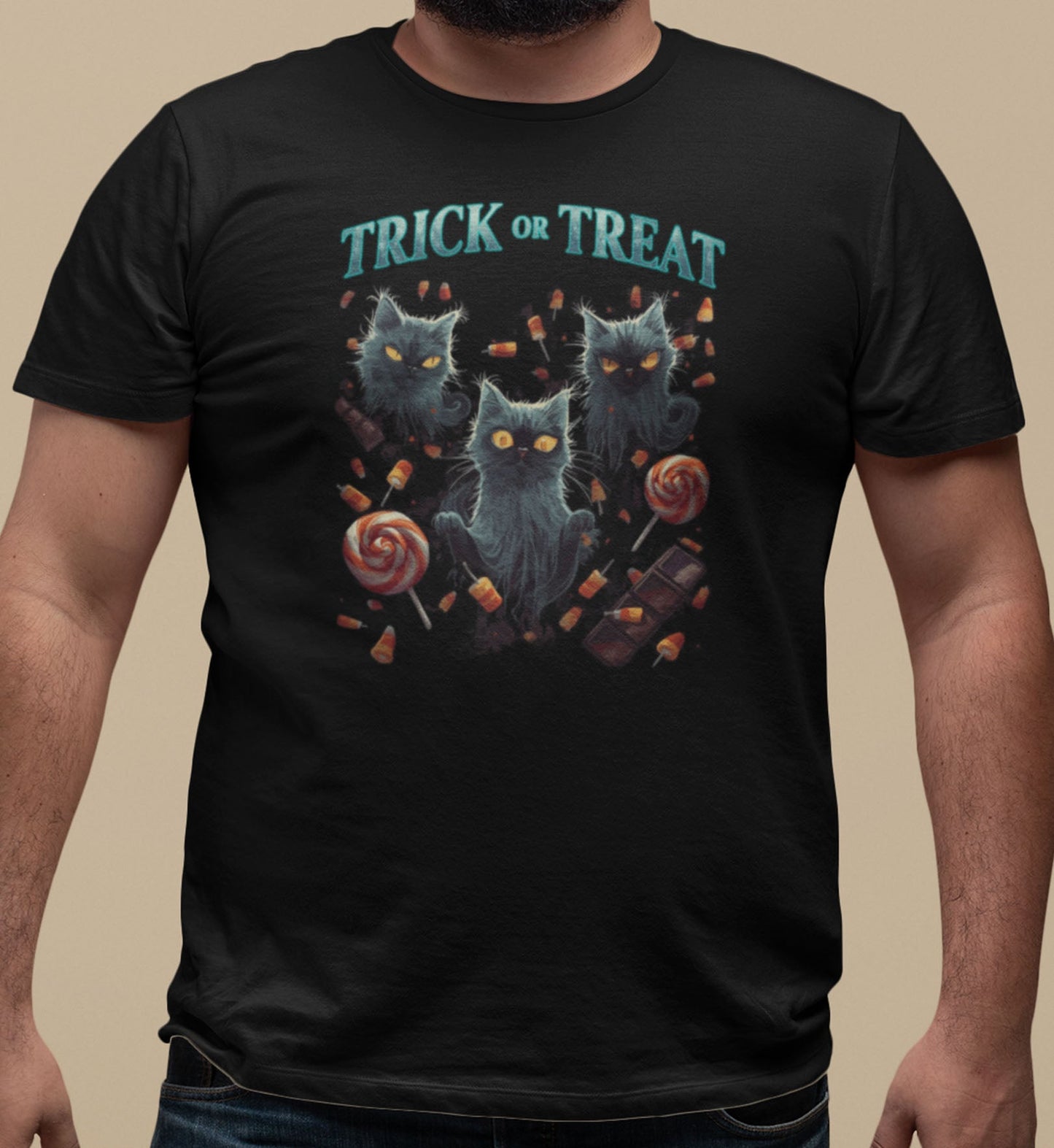 Close-up of Sweet But Spooky cat t-shirt print showing glowing-eyed ghost cats among candy corn, lollipops, and whimsical Halloween elements