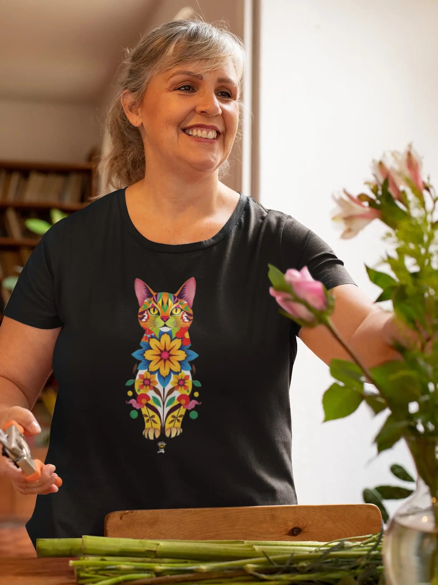 Model wearing Catflora floral cat silhouette women’s t-shirt, feminine artistic graphic tee 