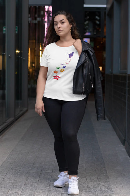 Model wearing Steps of Pride T-Shirt – unisex premium tee with minimalist black cat walking toward rainbow horizon, symbolizing pride and authenticity.