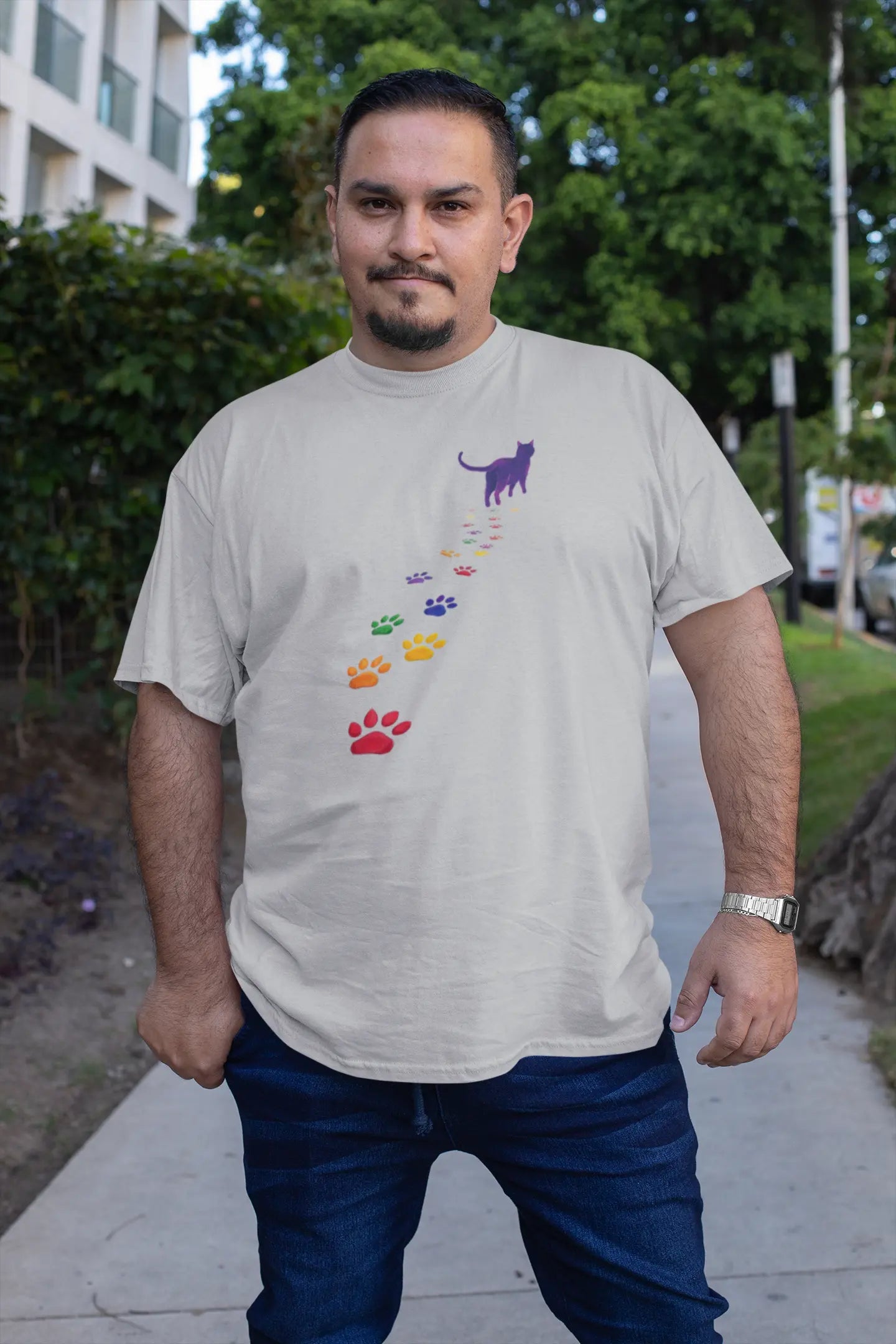 Person wearing Steps of Pride unisex T-shirt outdoors – stylish minimalist cat design representing pride, love, and self-expression.