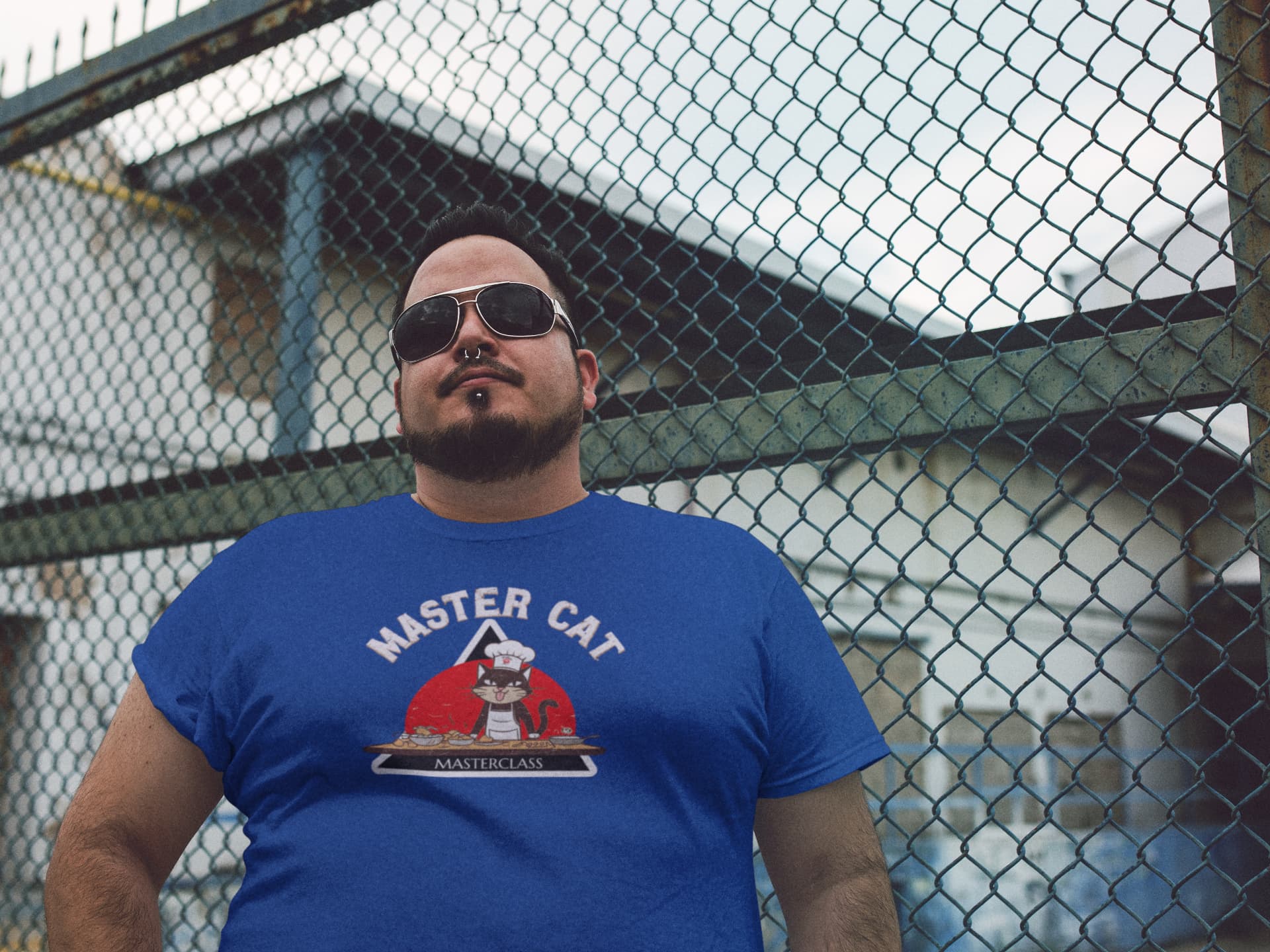 Model wearing Mastercat Masterclass Funny Cat Chef T-Shirt – unisex premium tee with humorous cooking cat design.