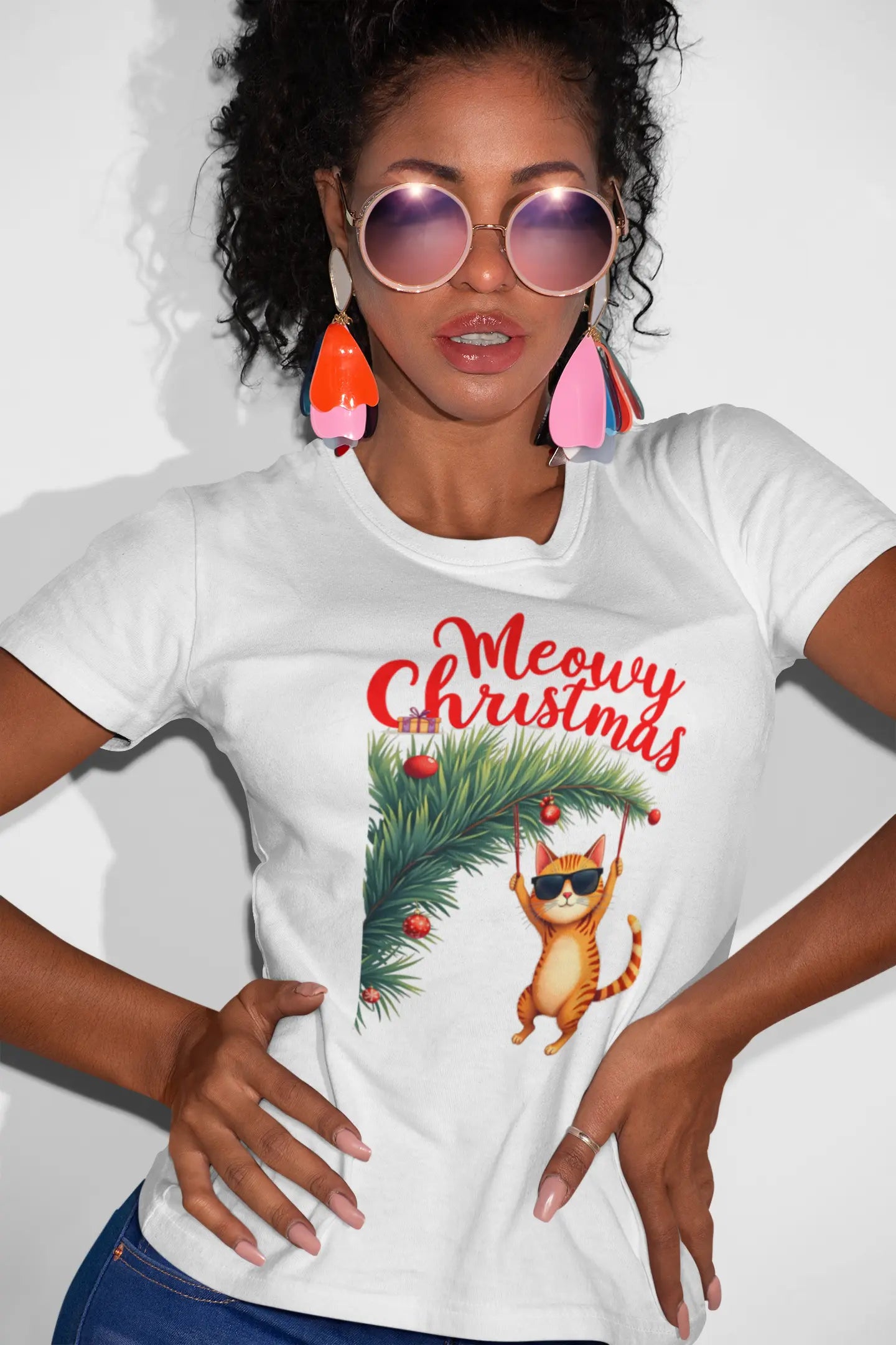 Person wearing Tree Diving Christmas Cat T-Shirt while setting up decorations – funny festive tee for cat owners and holiday humor fans.
