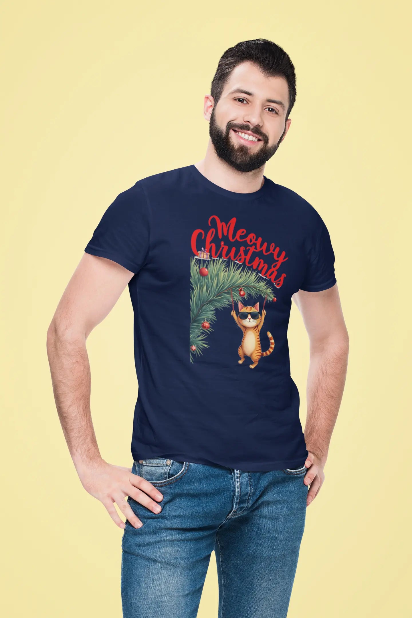 Model wearing Tree Diving Funny Christmas Cat T-Shirt – unisex premium tee featuring an orange cat in sunglasses hanging from a Christmas tree.